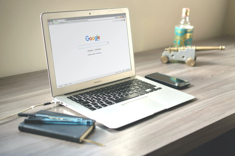 Photo of a journal with a MacBook